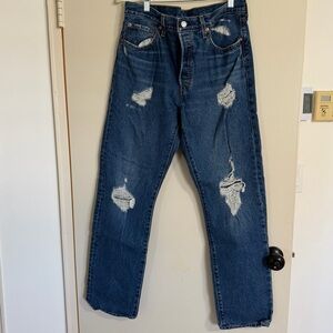 Lightly distressed dark wash Levi jeans